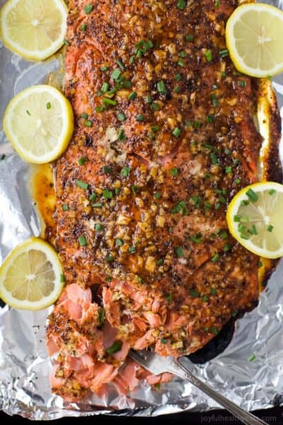 overhead photo of honey mustard baked salmon on a baking sheet