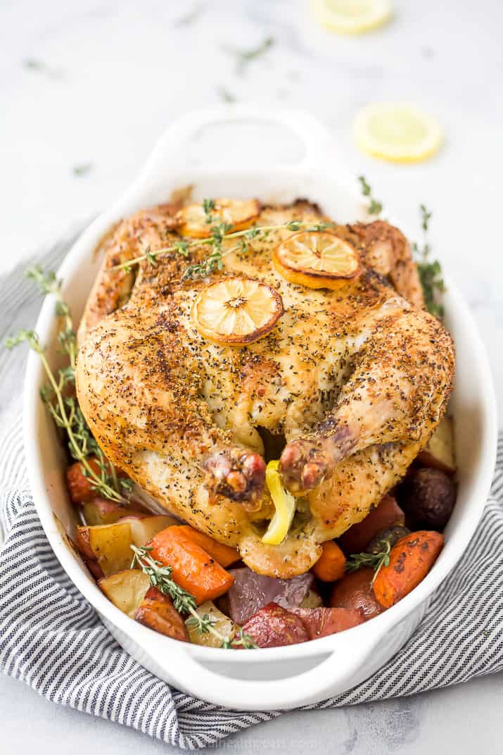 front photo of easy roasted chicken recipe with vegetables in a baking dish