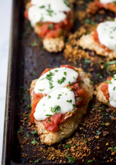 lighter baked chicken parmesan recipe on a baking sheet