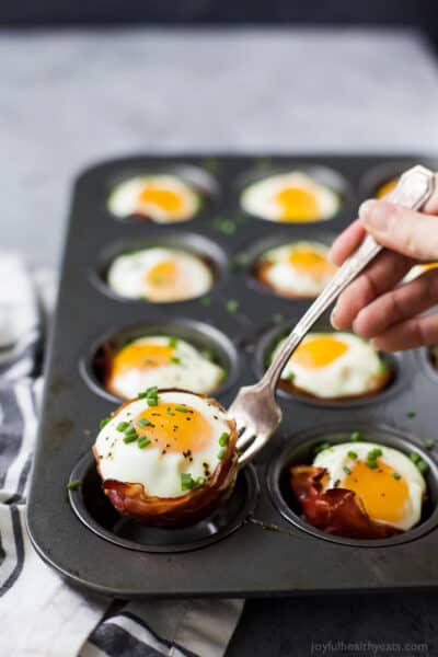 prosciutto baked egg cups in a muffin tin