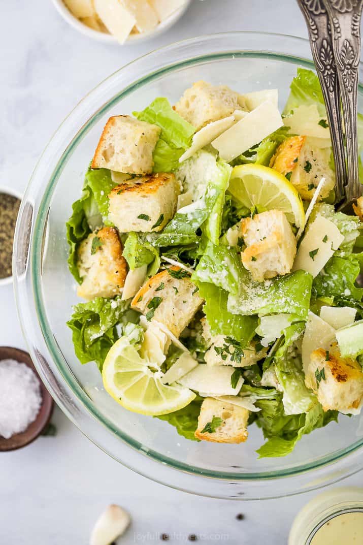 caesar salad with homemade croutons and dressing in a bowl