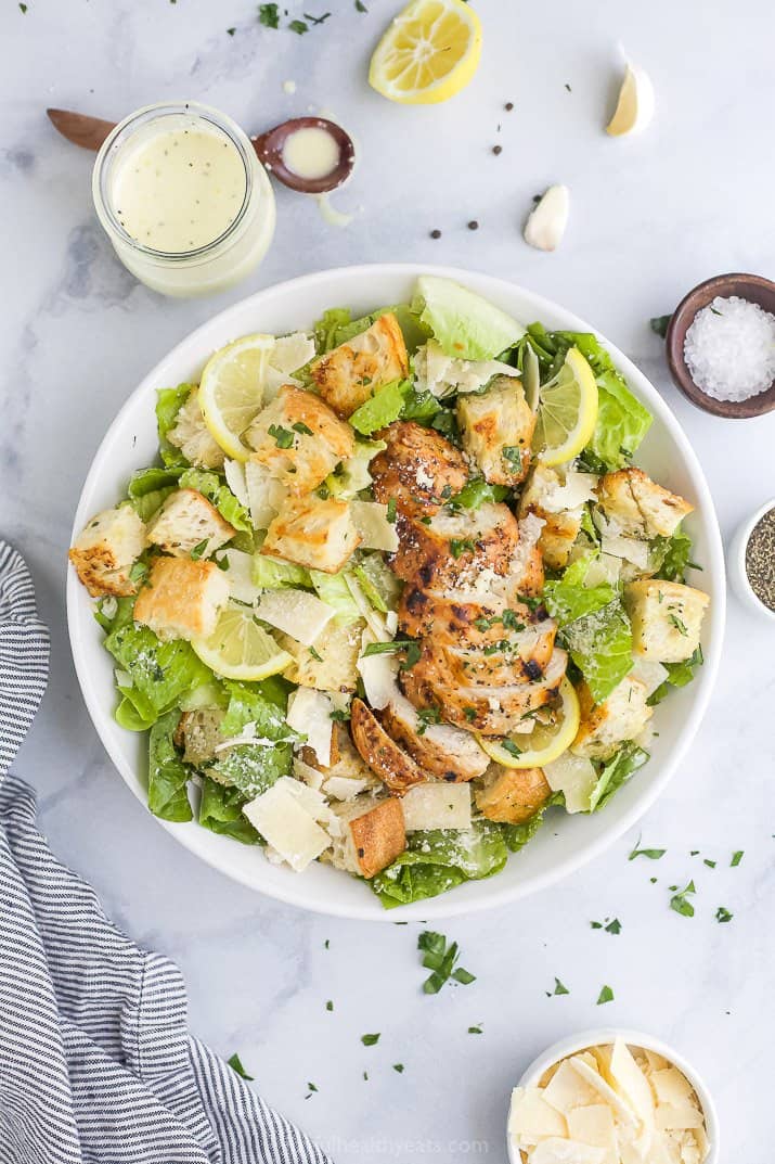 overhead photo of grilled chicken caesar salad with homemade dressing
