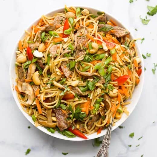 overhead photo of a bowl filled with easy spicy kung pao beef noodles