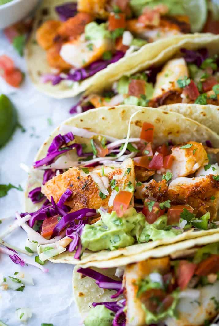 side photo of epic baja fish tacos with avocado crema and cabbage slaw