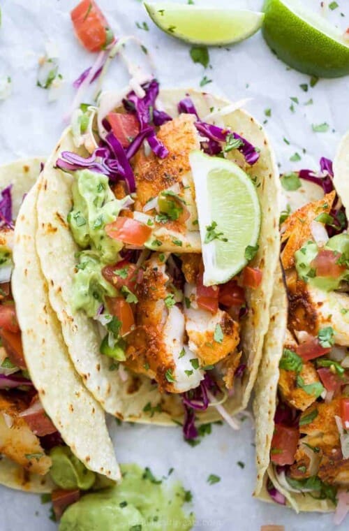 overhead photo of epic baja fish tacos with avocado crema