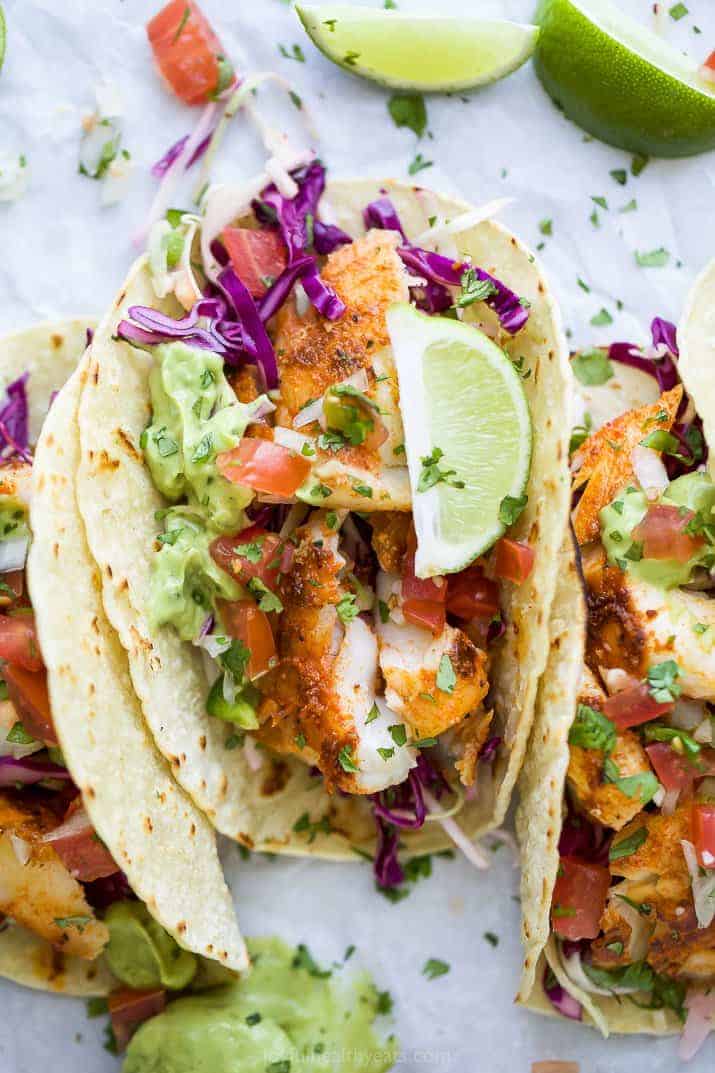 overhead photo of epic baja fish tacos with avocado crema