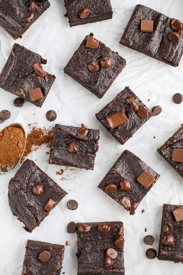 double chocolate avocado brownies scattered all over a board