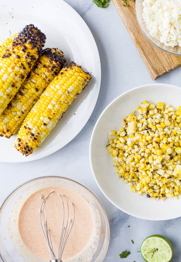 grilled corn and crema in a bowls