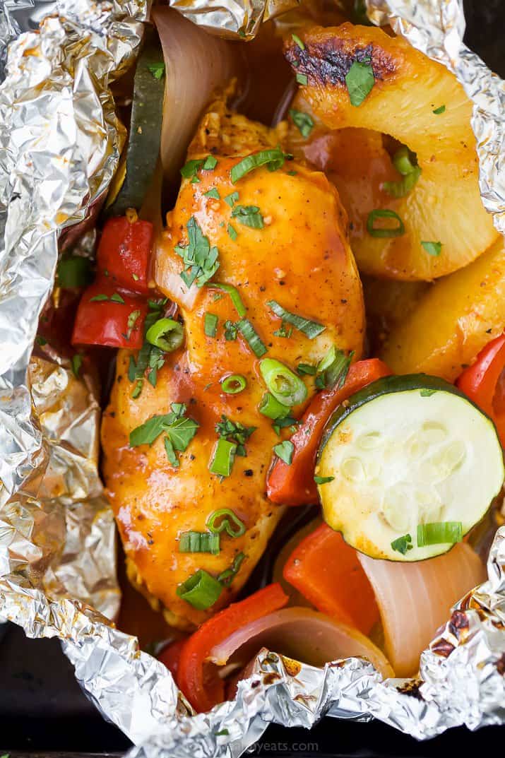 close up of grilled hawaiian bbq chicken in foil packets