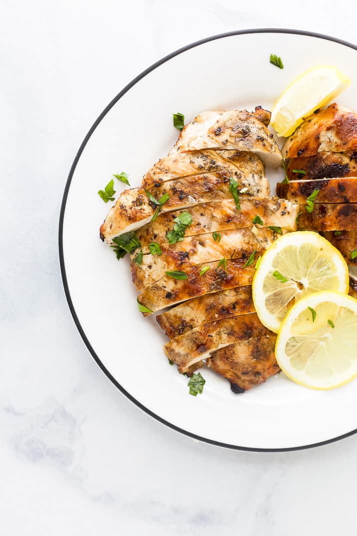 grilled greek chicken on a plate with lemon