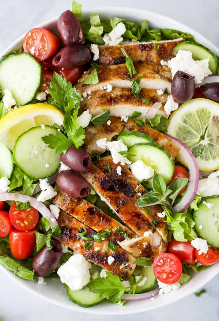 close up of greek salad with grilled chicken