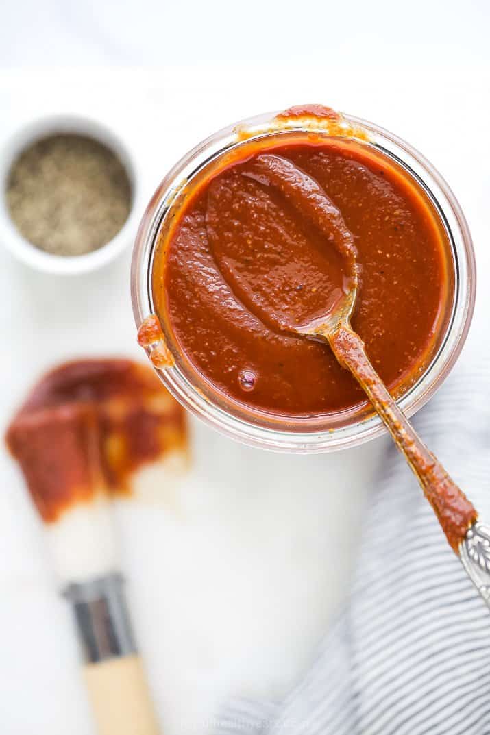 a spoon scooping homemade bbq sauce