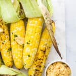 Close up of finished grilled corn on the cob with honey chipotle butter