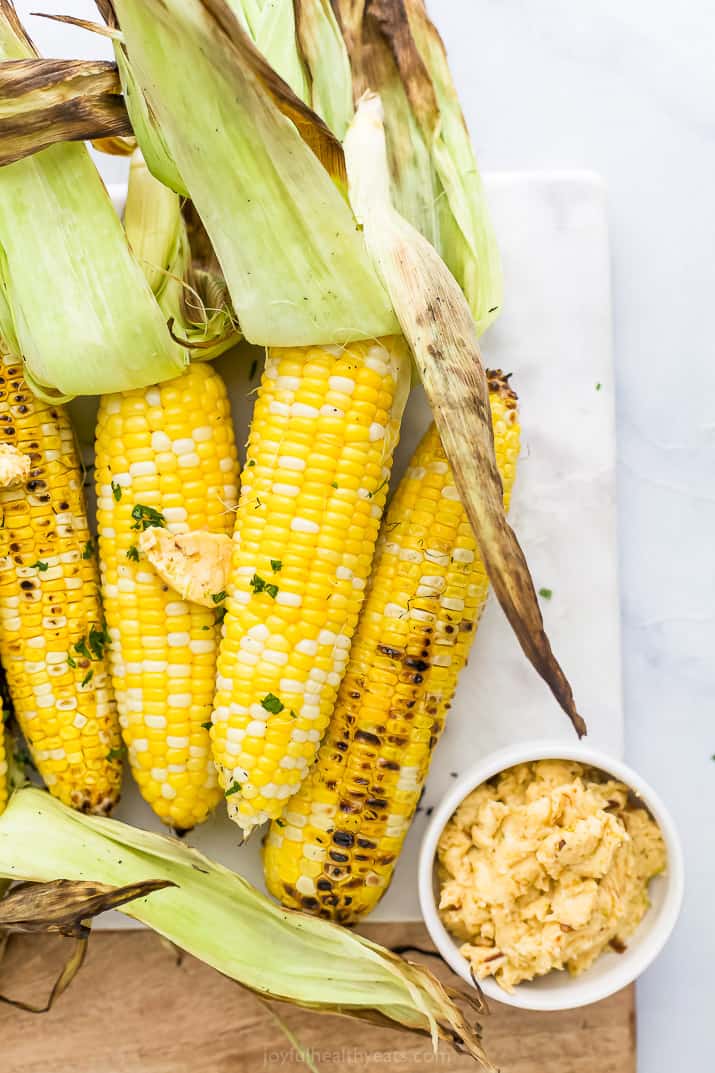 Close up of finished grilled corn on the cob with honey chipotle butter