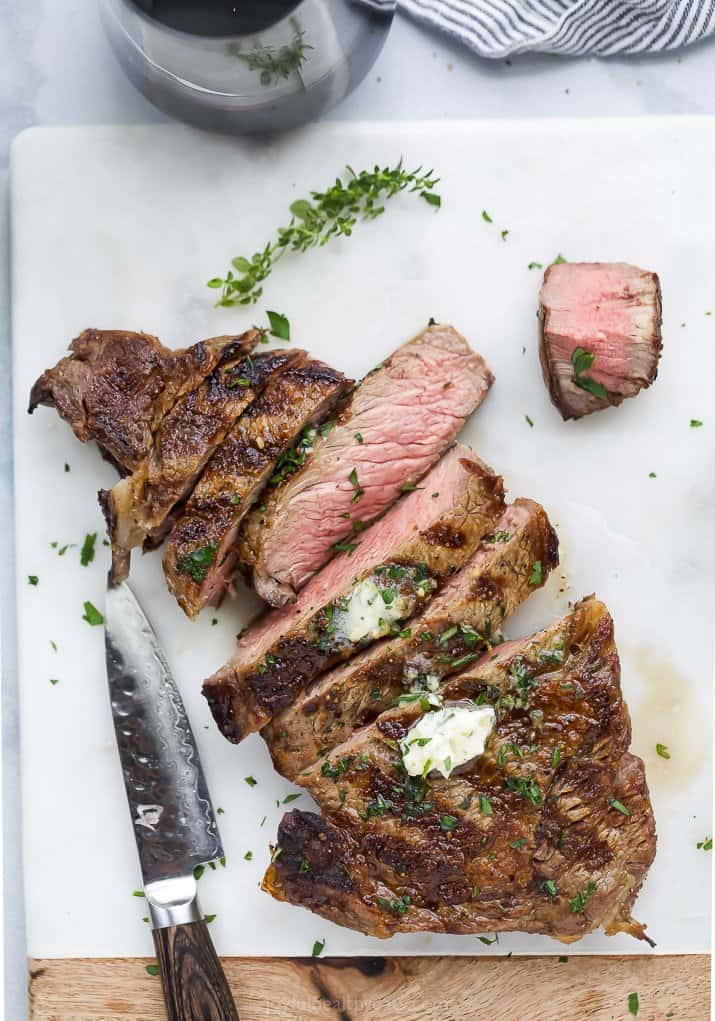 grilled ribeye steak topped with garlic herb butter