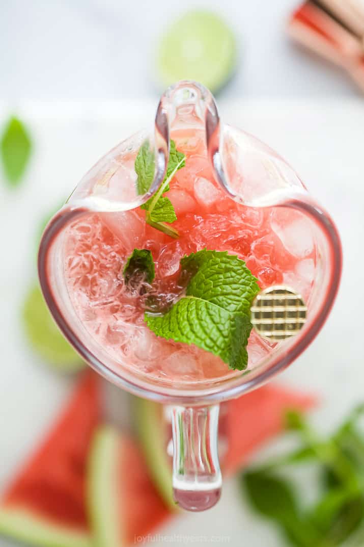 overhead photo of a pitcher filled with watermelon cucumber gin cocktail