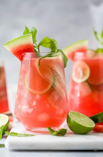 a glass filled with watermelon cucumber gin cocktail