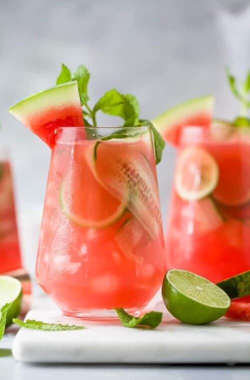 a glass filled with watermelon cucumber gin cocktail