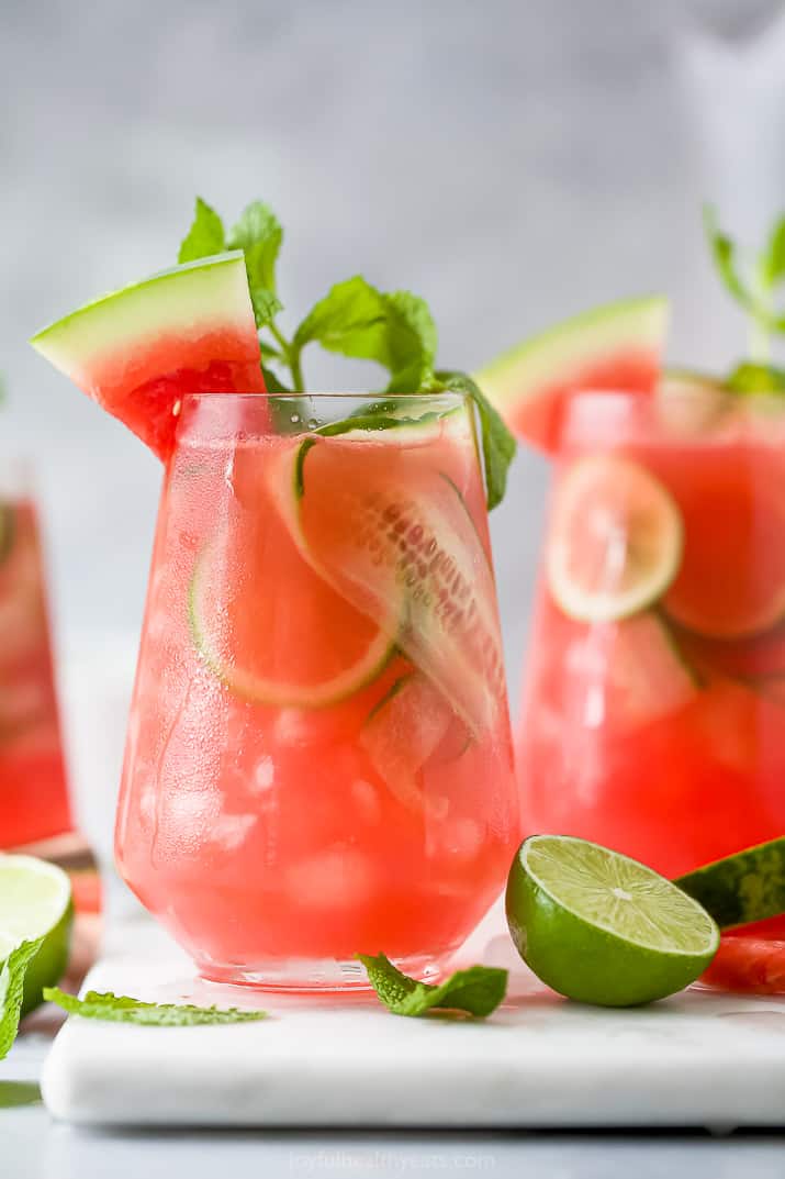 a glass filled with watermelon cucumber gin cocktail