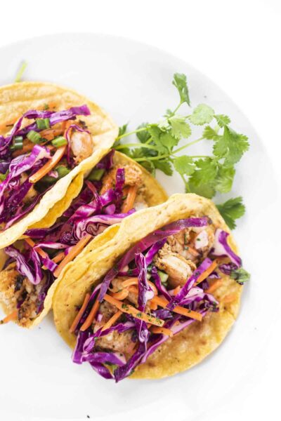 grilled shrimp tacos with slaw on a plate