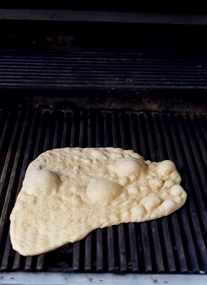 homemade pizza dough being grilled