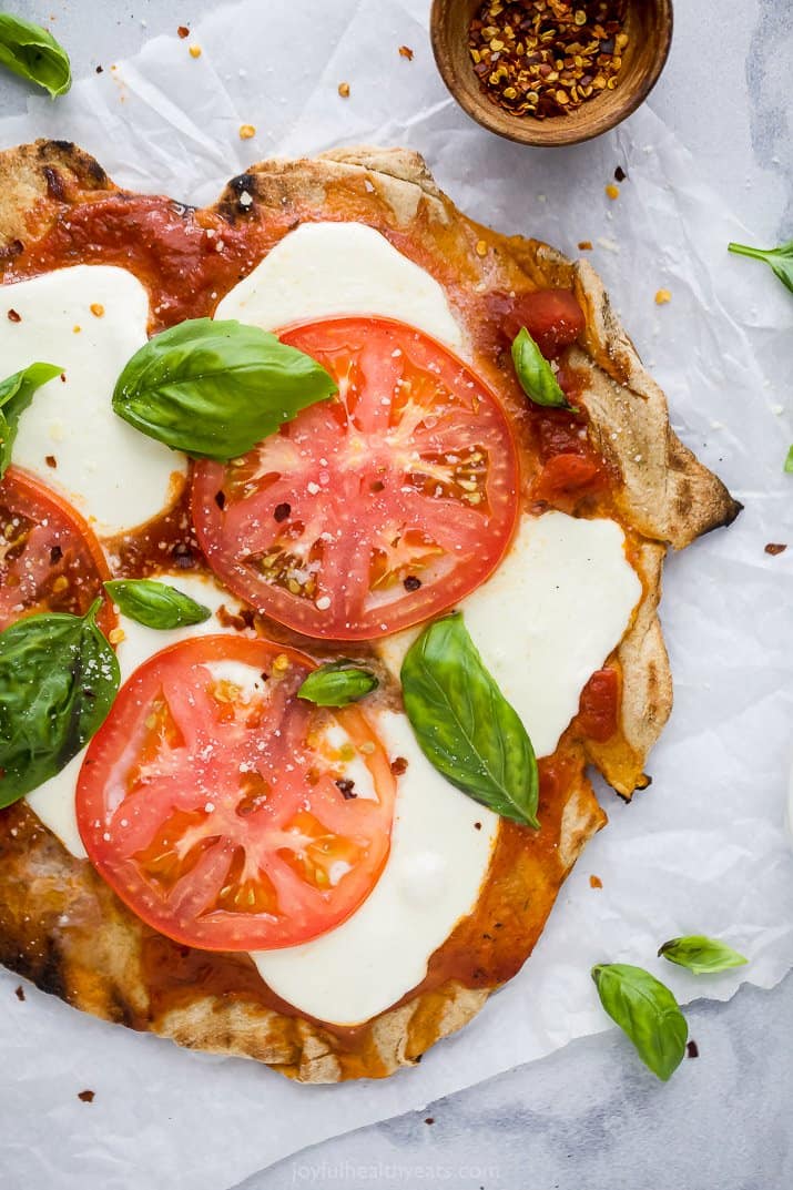 overhead photo of the best grilled pizza recipe topped with margherita toppings