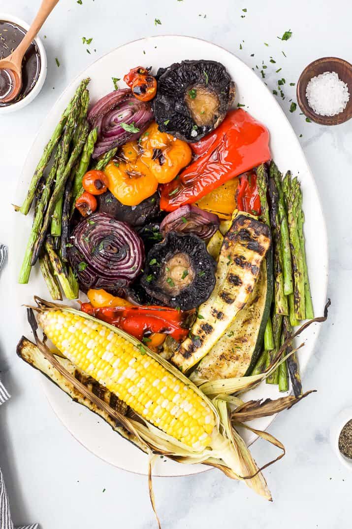 a platter filled with the best grilled vegetables and a balsamic dressing