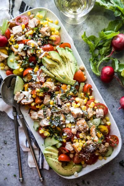 summer chickpea salad with grilled chicken on a plate