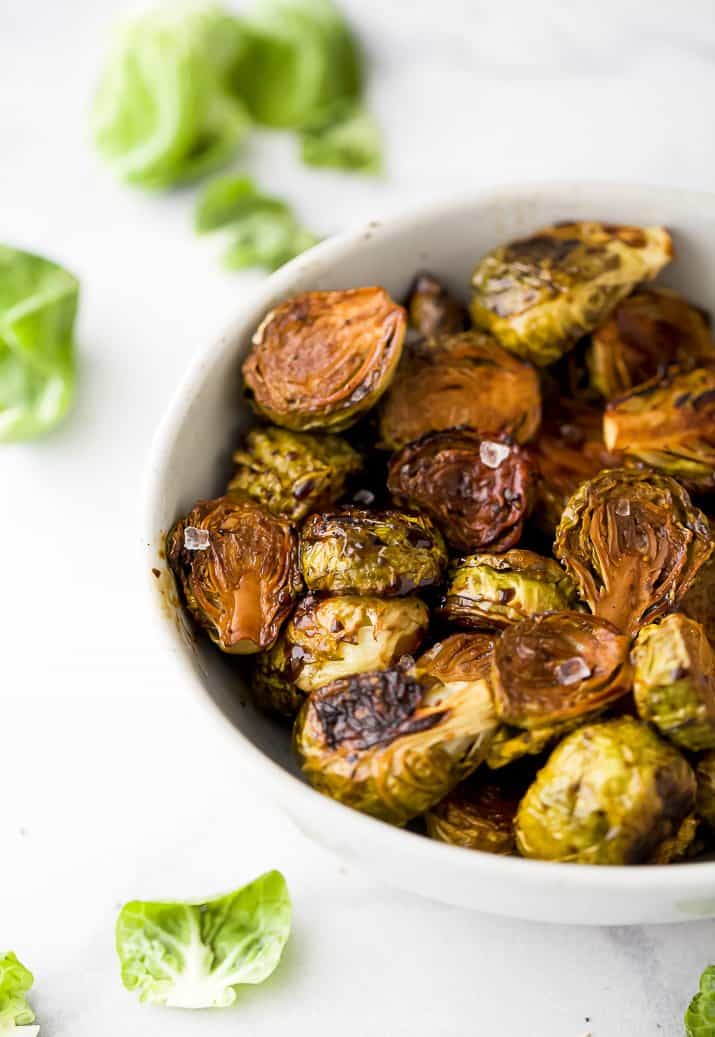 a bowl filled with roasted brussel sprouts