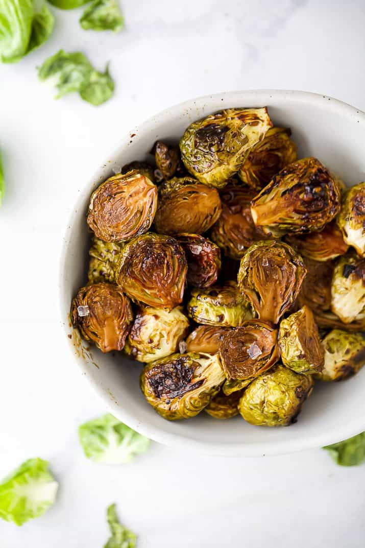 a bowl filled with roasted balsamic brussel sprouts