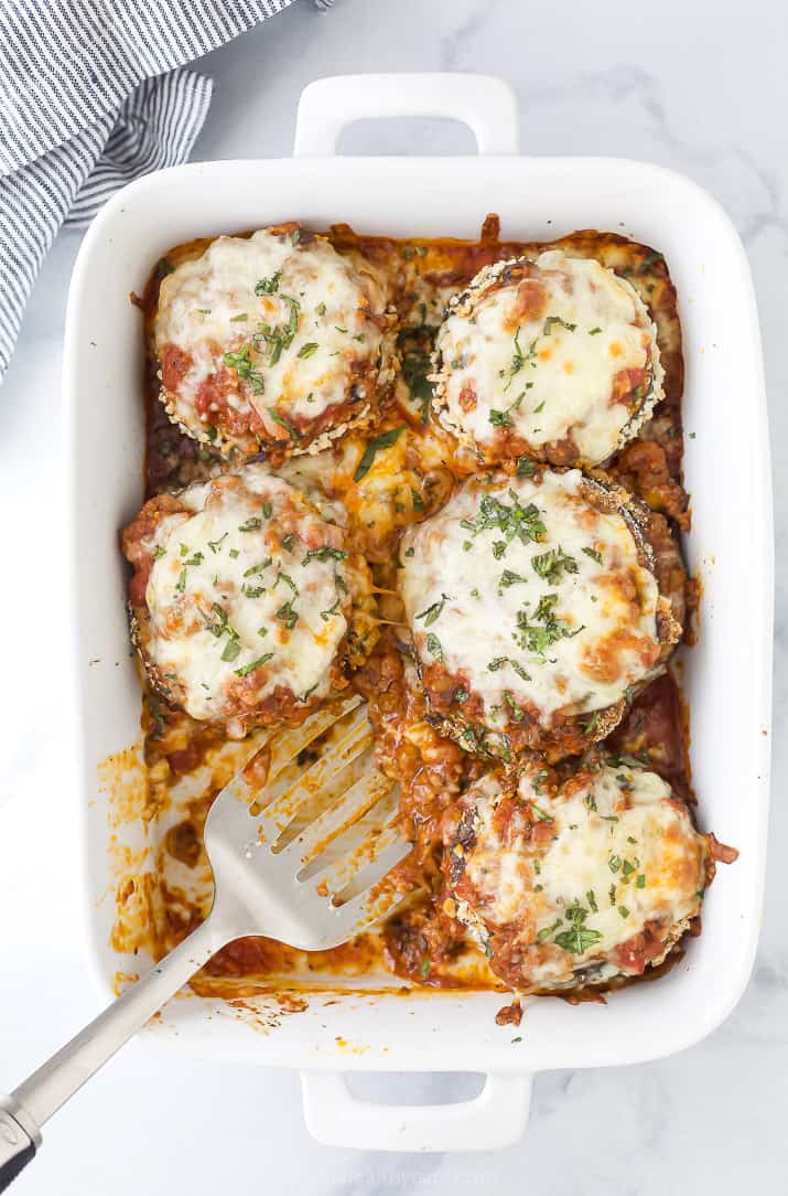 a baking dish filled with eggplant parmesan