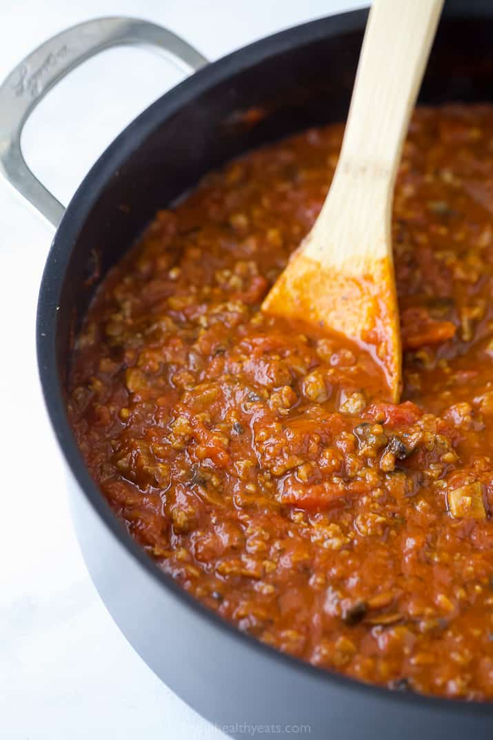 a pot filled with mushroom italian sausage sauce