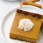 close up of pumpkin pie bars on a plate