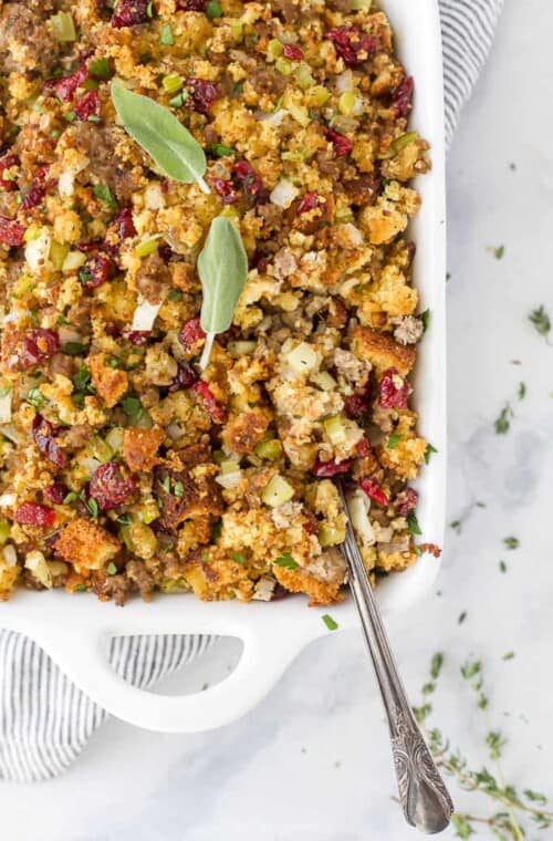 a spoon scooping cornbread stuffing