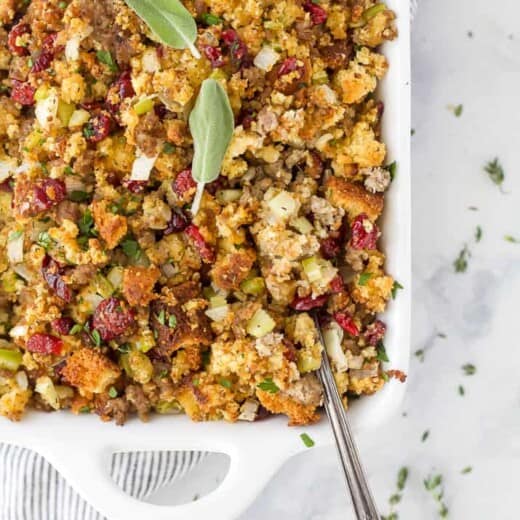 a spoon scooping cornbread stuffing