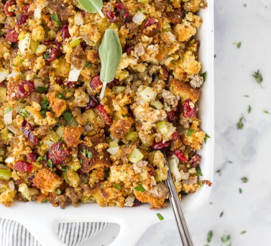 a spoon scooping cornbread stuffing