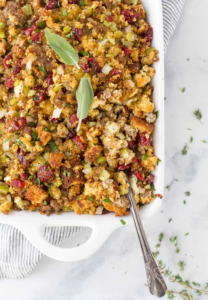 a spoon scooping cornbread stuffing