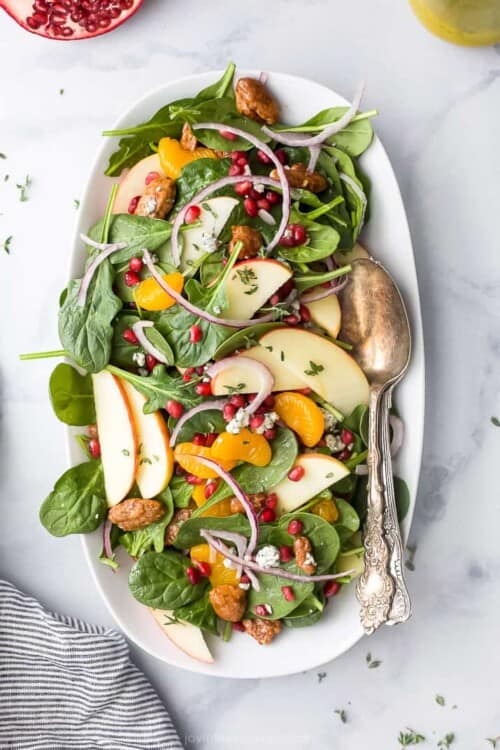 spinach salad with apple orange and pomegranates