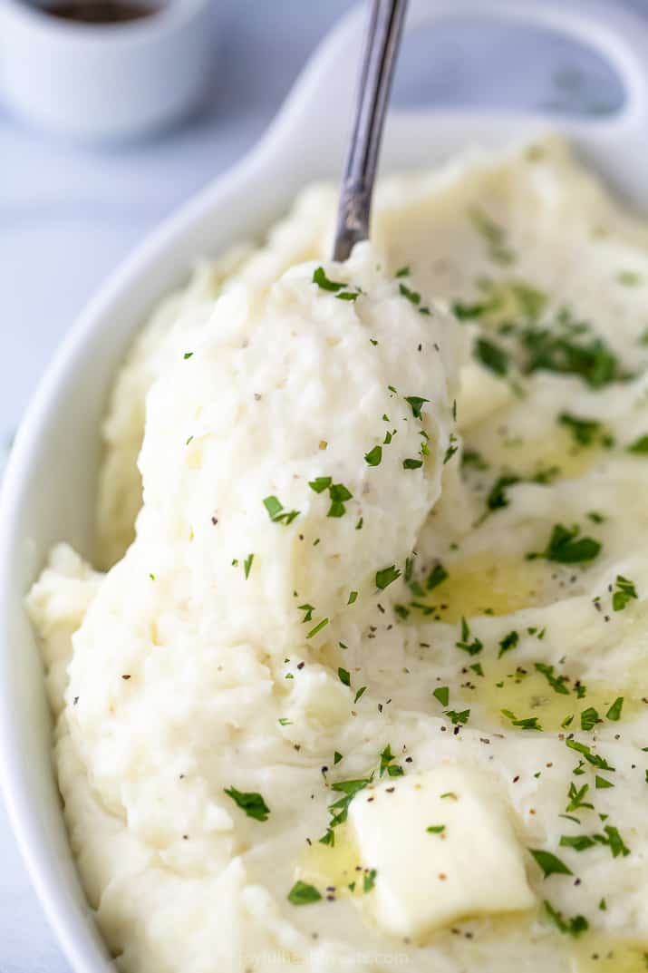 a spoon scooping mashed potatoes