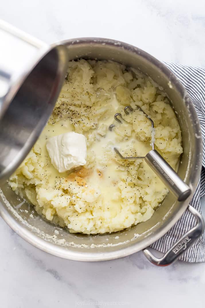 a pot filled with ingredients for mashed potatoes