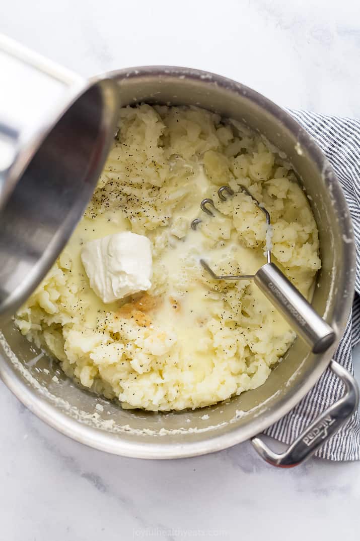 a pot filled with ingredients for mashed potatoes