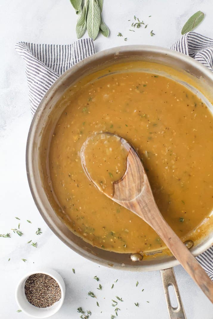 a saucepan filled with turkey gravy