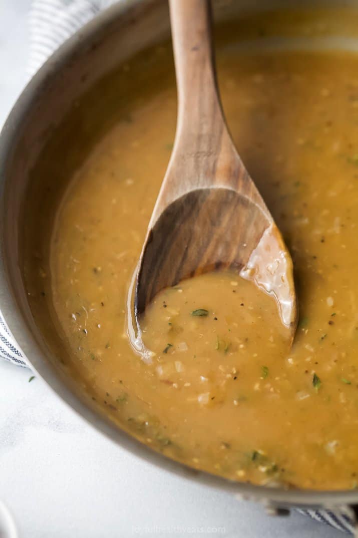 turkey gravy in a pan with a spoon