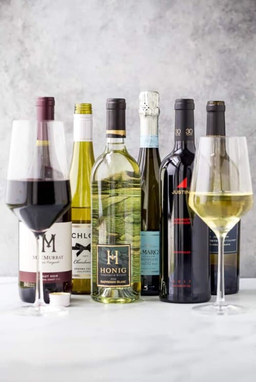 wine bottles with wine glasses