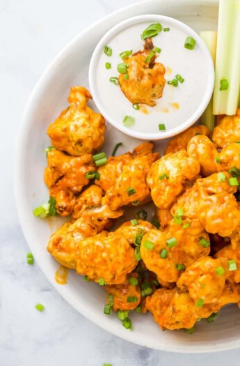 Buffalo Wings in a White Bowl with a Side of Ranch Dressing