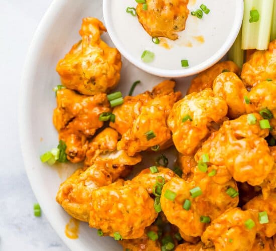 Buffalo Wings in a White Bowl with a Side of Ranch Dressing