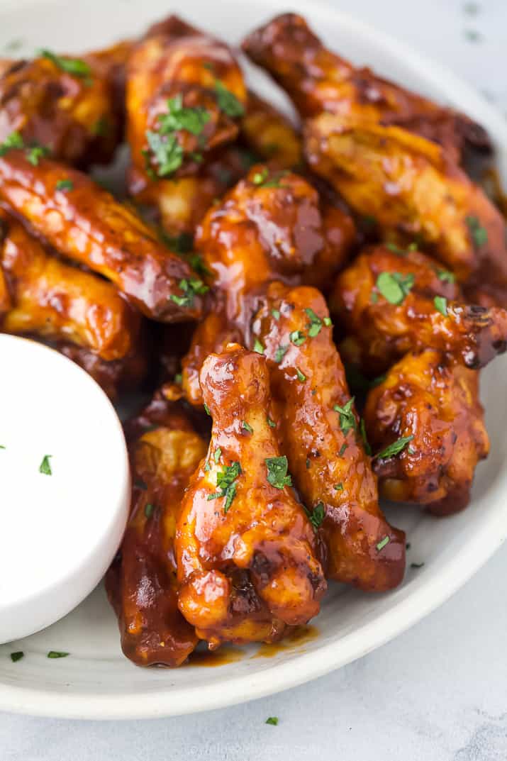 A Close-up Shot of a Pile of Wings Covered in Honey Barbecue Sauce