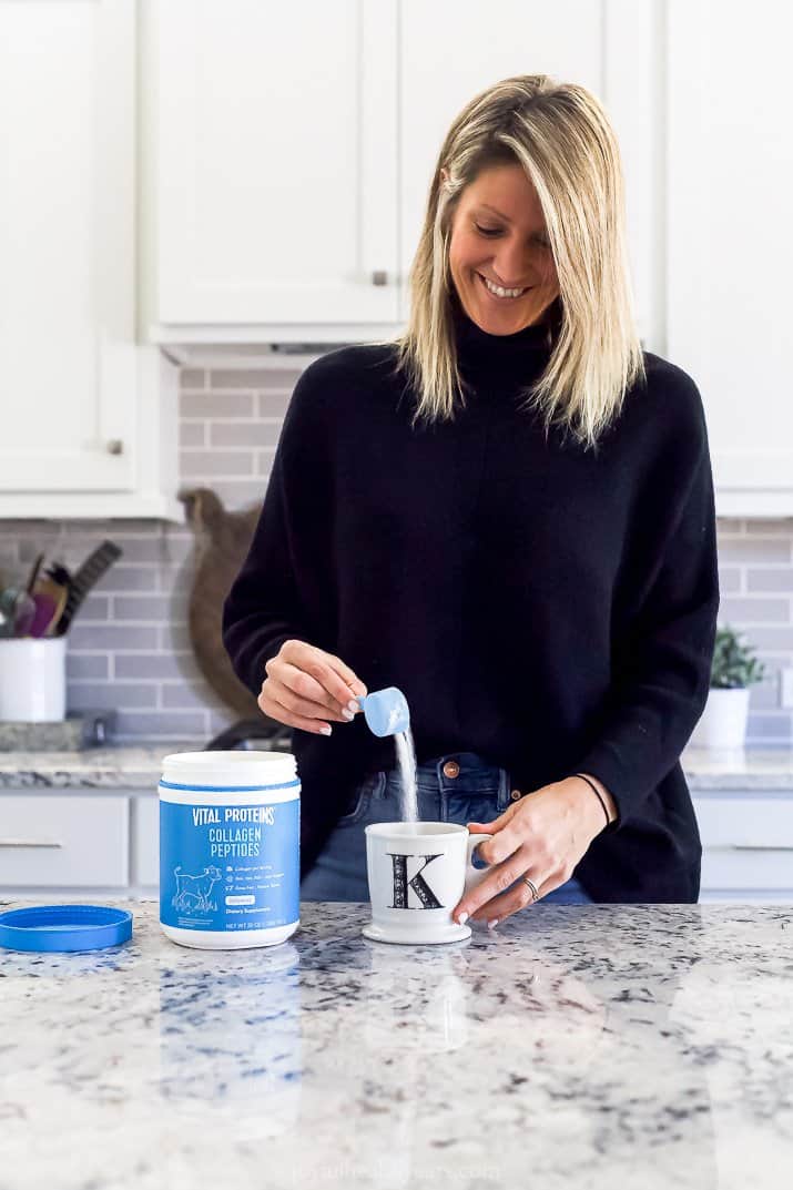 girl pouring vital proteins collagen peptides into coffee cup