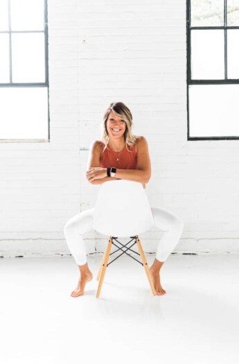 girl in workout clothes on a chair