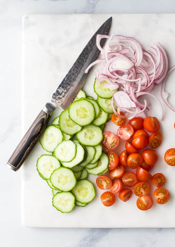 vegetables chopped up on a cutting board